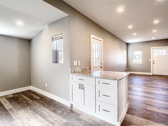 New flooring, recessed-dimmed lighting, window coverings