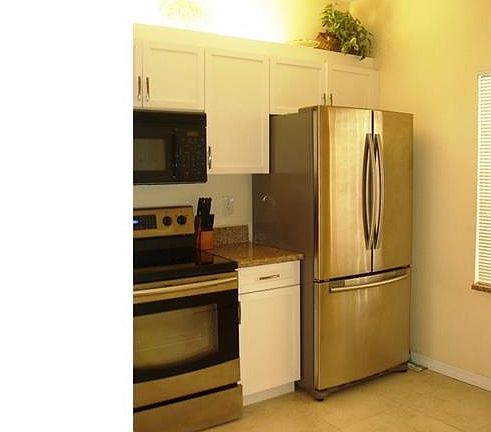 A sleek new French door frig is one of many improvements.