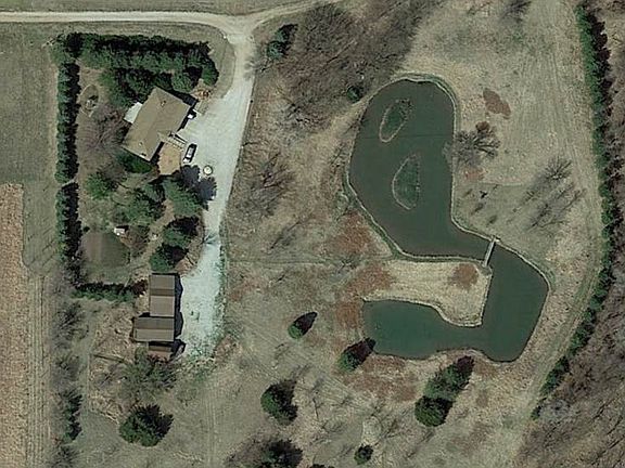 Home, outbuildings, pond