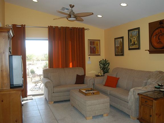 Family Room with Vaulted Ceiling, Sliding Glass Doors to Patio & Ceiling Fan