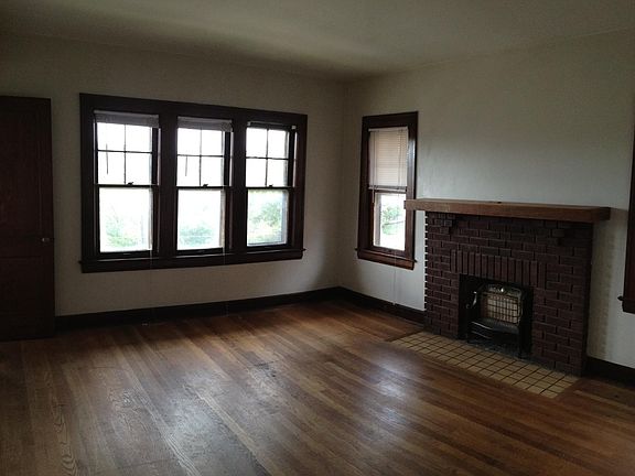 Living room with decorative fireplace
