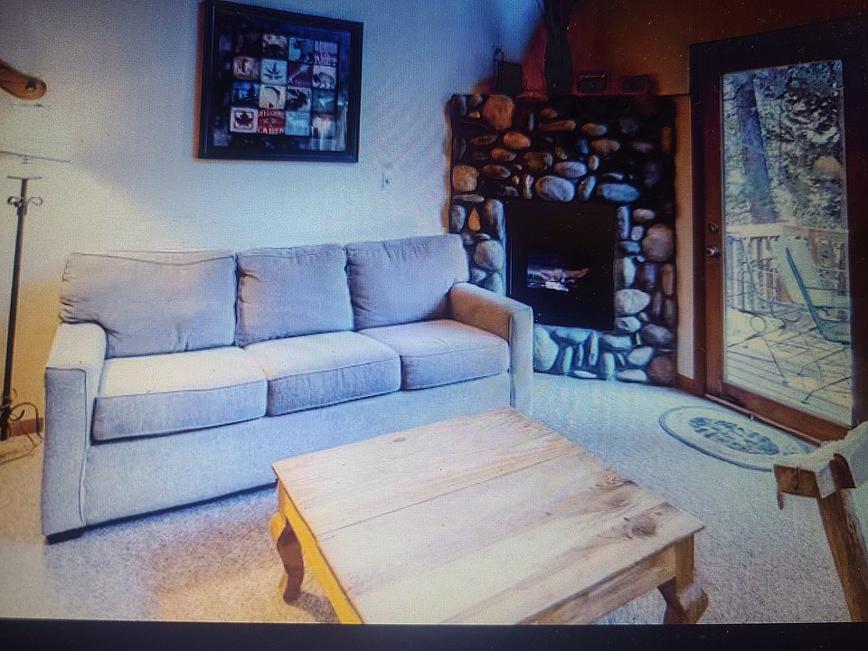 Living Room has views of the deck and beautiful river.