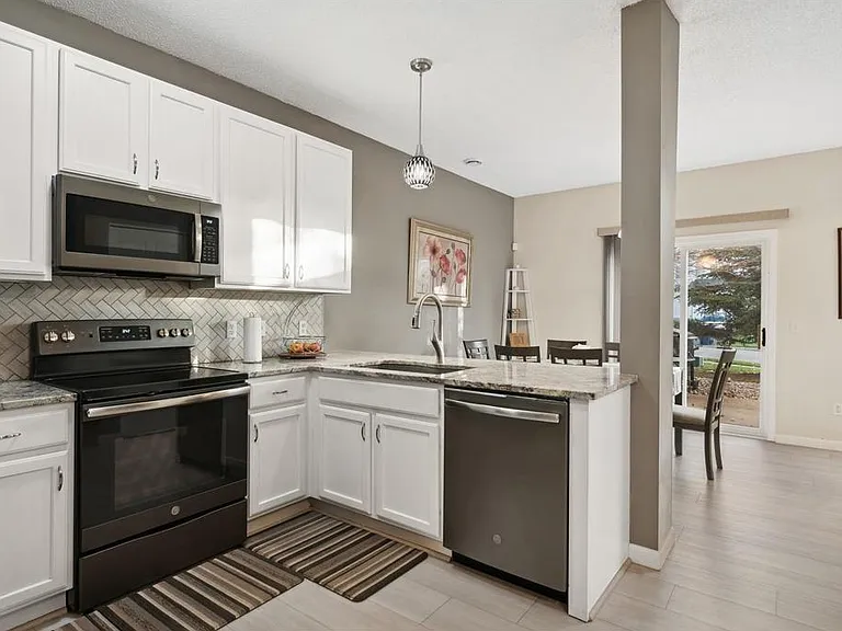 Kitchen view with White cabinets