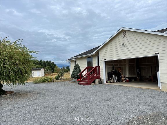 Finished 2-car garage and circular driveway for convenience.