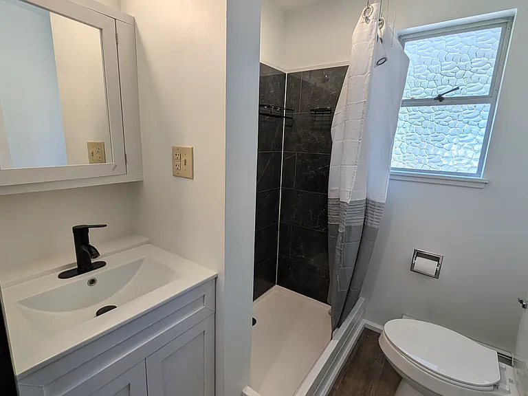 Bathroom is near the kitchen