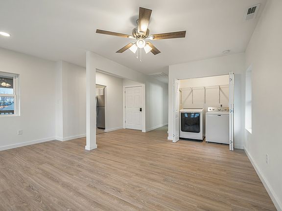 Living room with in-unit washer/dryer