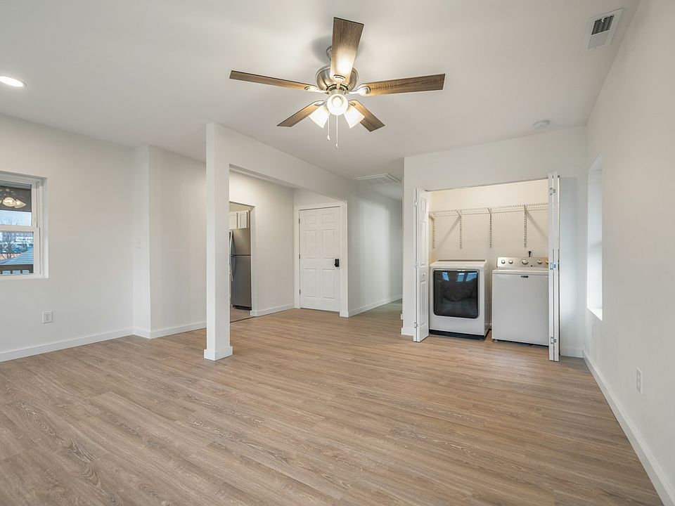 Living room with in-unit washer/dryer