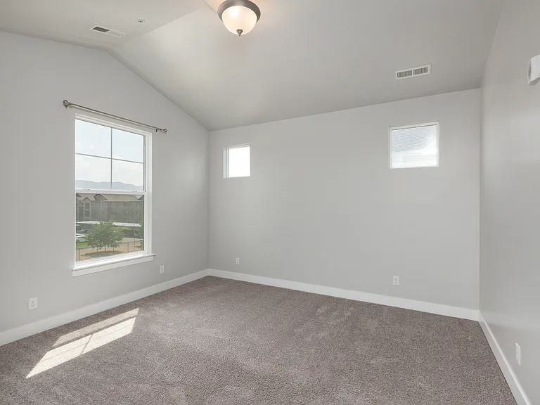 Master Bedroom with vaulted ceiling.