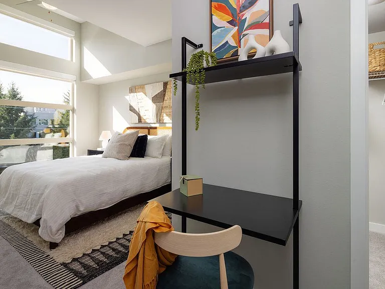 Primary bedroom with tall windows for natural light