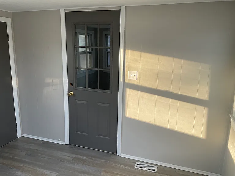 Steel entry door from 3 season room into kitchen