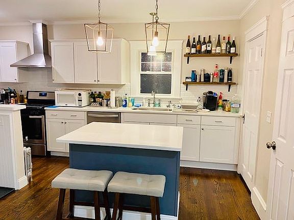 View of kitchen from open living and dining room