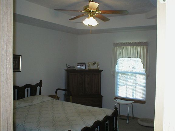 The large master bedroom has a vaulted ceiling.