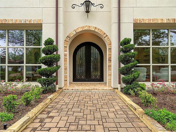 Timeless design and materials are characteristic of this grand home.