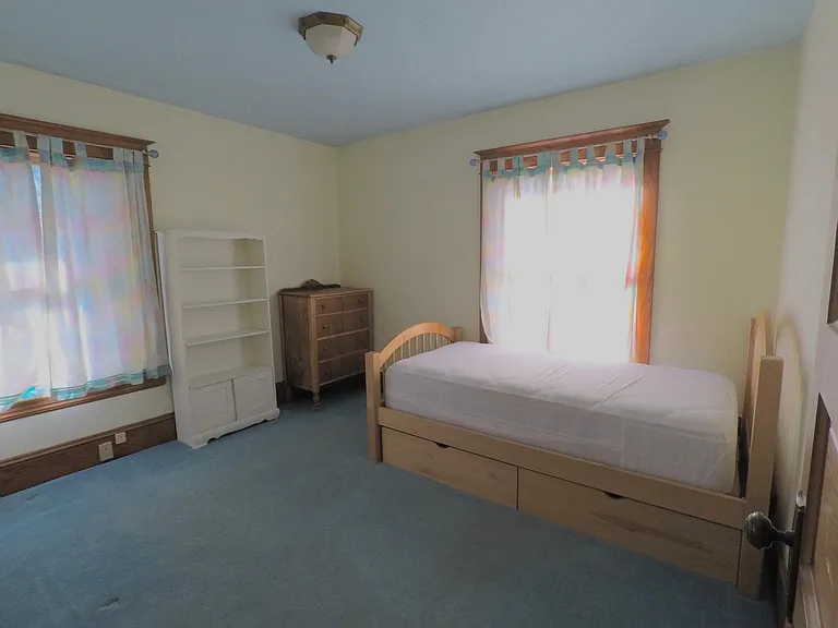 Upstairs SW Bedroom: 9'10" x 11'6" (the furniture is gone, the room is painted white and the floor is refinished fir)