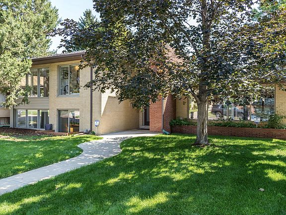 This mid-century tri-level ranch has curb appeal
