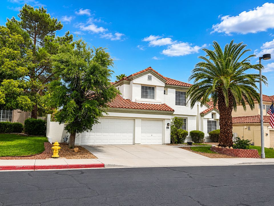 Beautiful two-story Las Vegas home with mature palms and great curb appeal