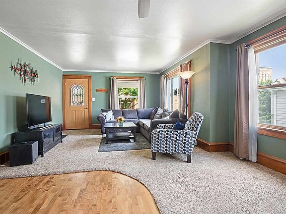 Newly refinished hardwoods and newer carpet.