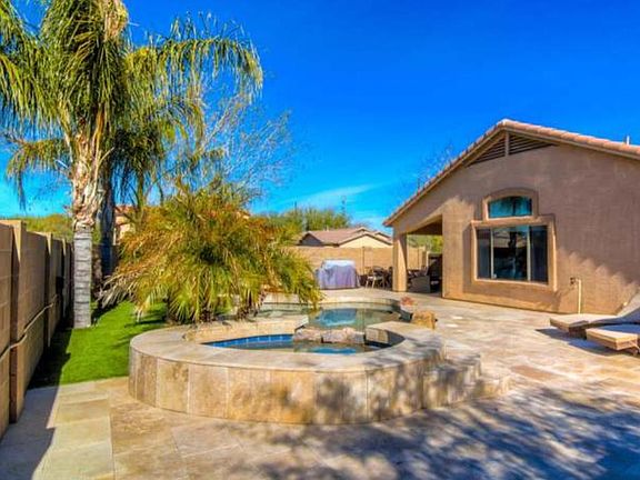 Low maintenance yard w/ artificial turf.