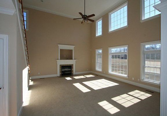 Amazing two story great room w/second staircase and large windows