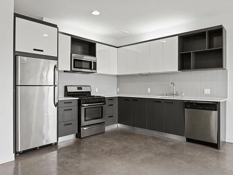 Kitchen with Stainless-Steel Refrigerator, Stove, Microwave Oven, and Dishwasher