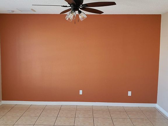 Living room, including ceramic tittle and high ceiling.