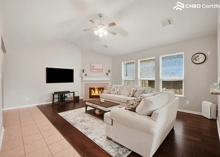 Wide-open living room with a gas fireplace