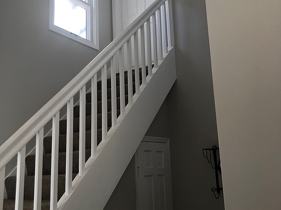 Staircase to the upper 2 bedroom unit.