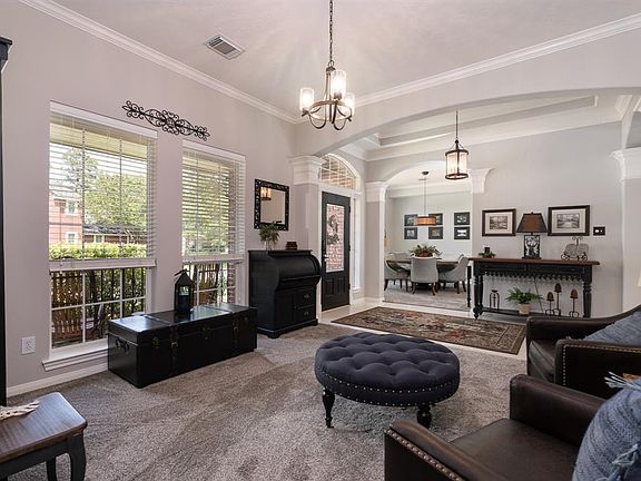 Entry is open to the informal living and dining rooms. Both have crown molding, upgraded lighting, and plush carpet that will want to make you bounce on your toes!