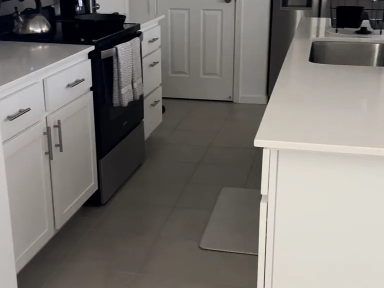 Kitchen with lots of cabinet space, all stainless steel appliances. Electric stove, refrigerator, microwave and dishwasher included.