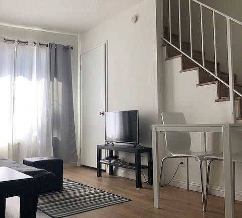 Small Stand with flat screen TV, small table and chairs 