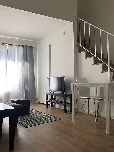 Small Stand with flat screen TV, small table and chairs