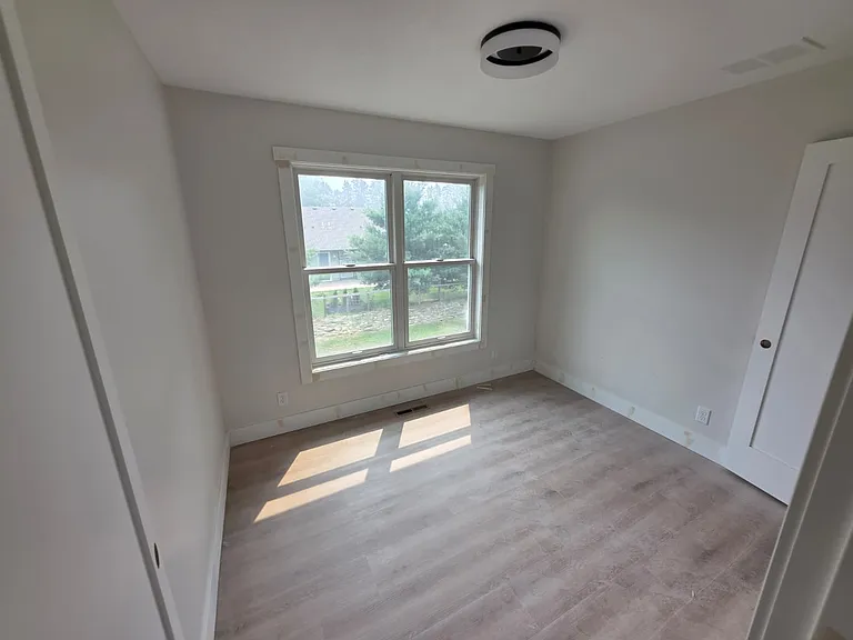 Rear facing bedroom 2 with new Anderson windows.