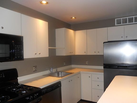 Kitchen: Stainless Steel (Gas Range, Overhead Microwave, Dishwasher, Refrigerator) and Island Bar with two stools included.