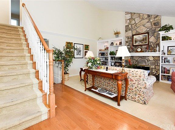 Beautiful entry that opens to a formal living room and fireplace.