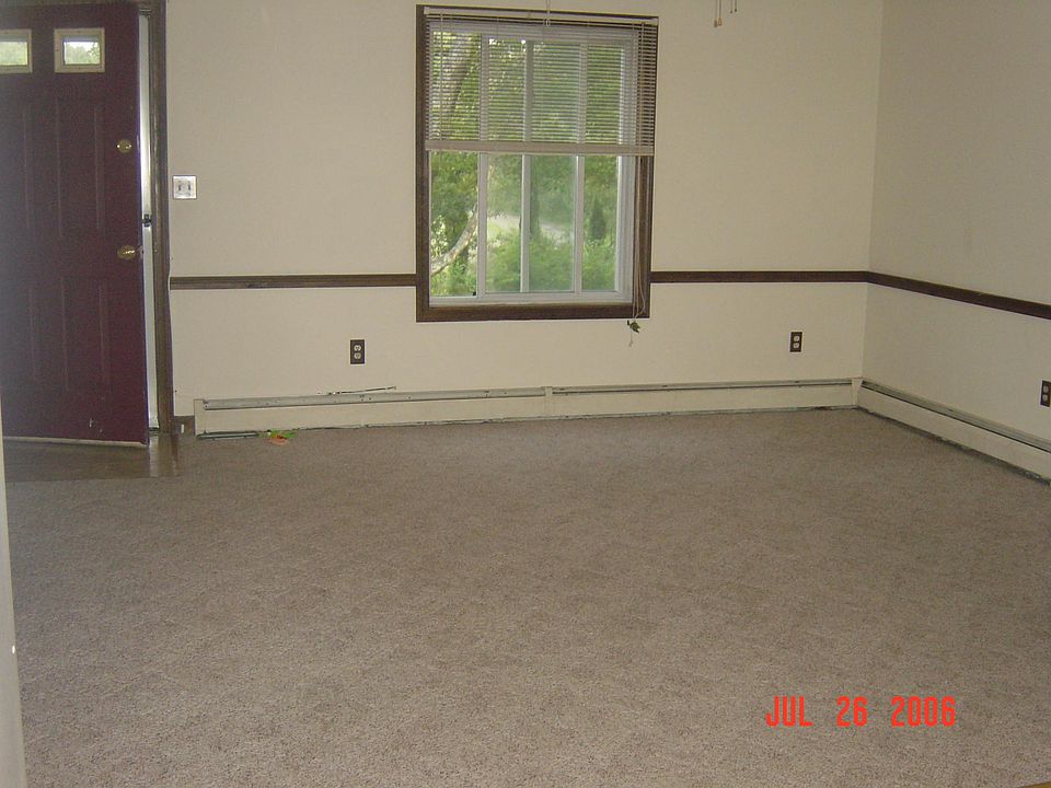 Living room - the rug is gone and replaced with flooring.
