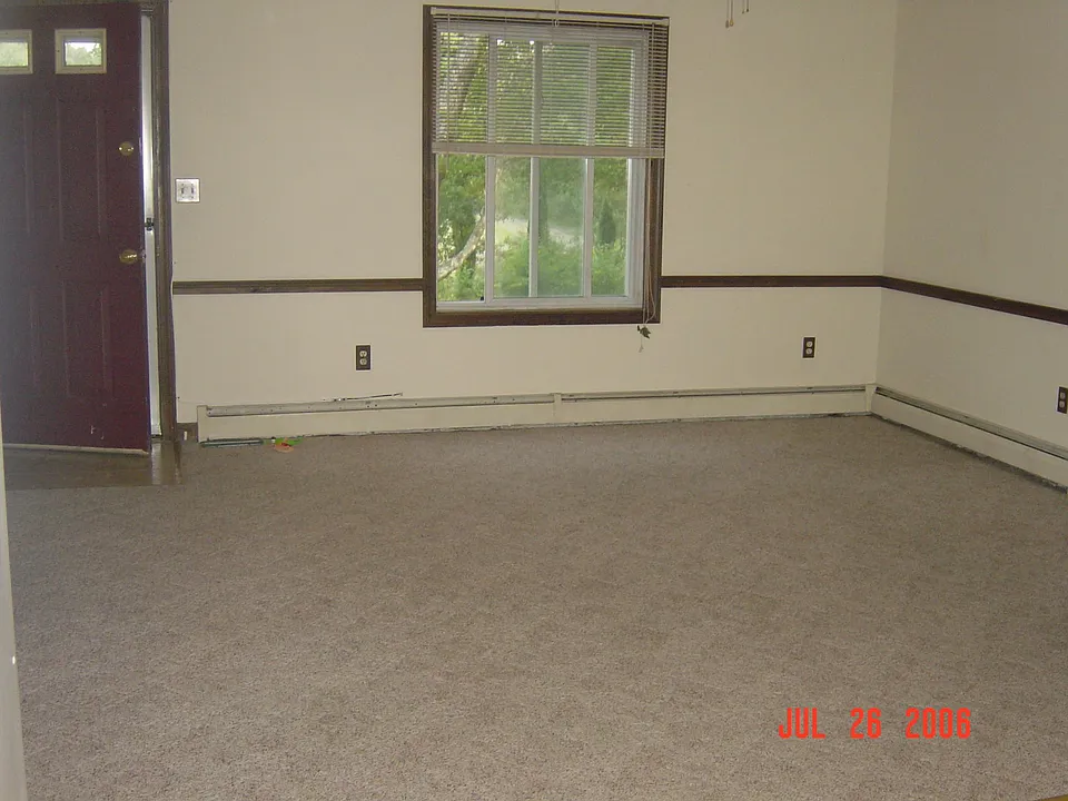 Living room - the rug is gone and replaced with flooring.