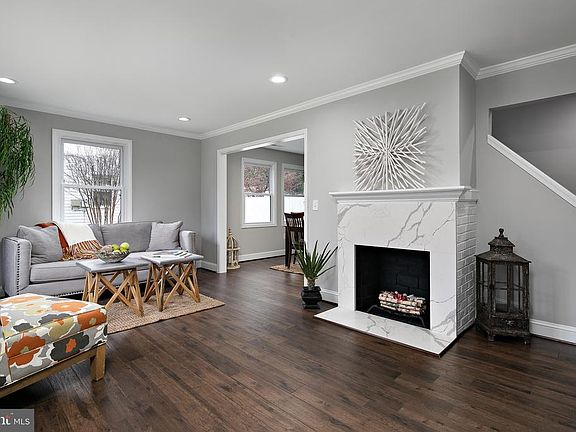 LIVING RM  HAS FPLC  W/QUARTZ HEARTH & SURROUND