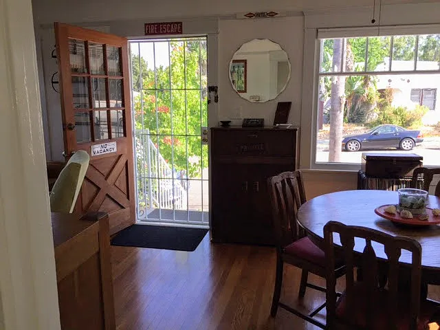 Front family room with bright windows on 3 of the walls & built in cabinets