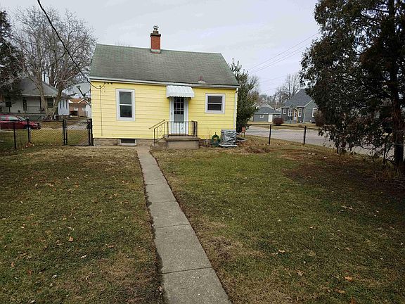 Large rear yard. Newer black vinyl coated chain link fence.