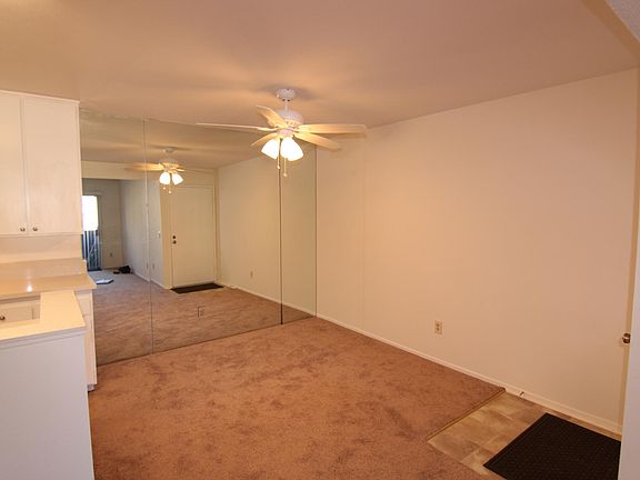 Dining area with ceiling fan.