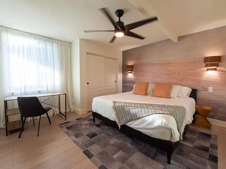 Fourth bedroom has a working desk and King sized bed as well as television.