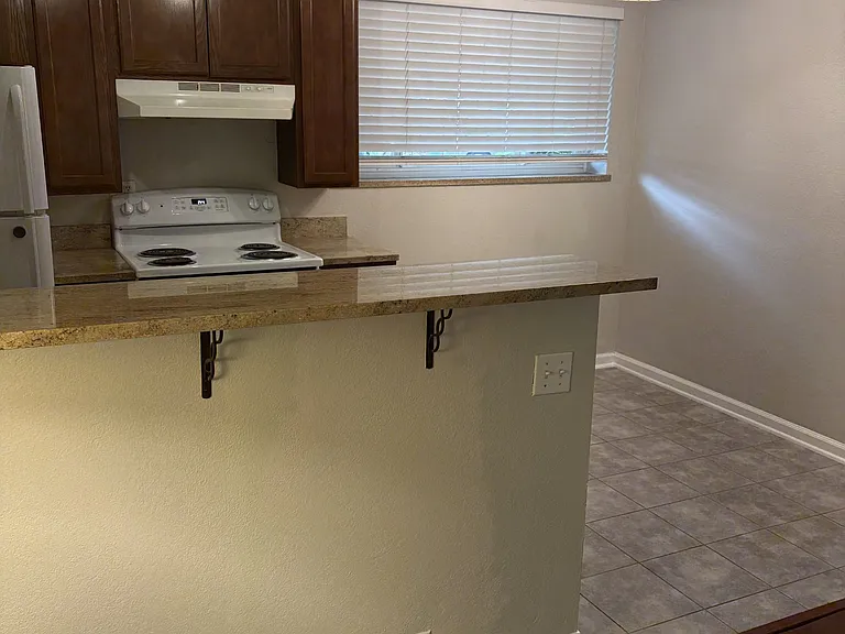 Kitchen bar counter - newly pained, unfurnished.