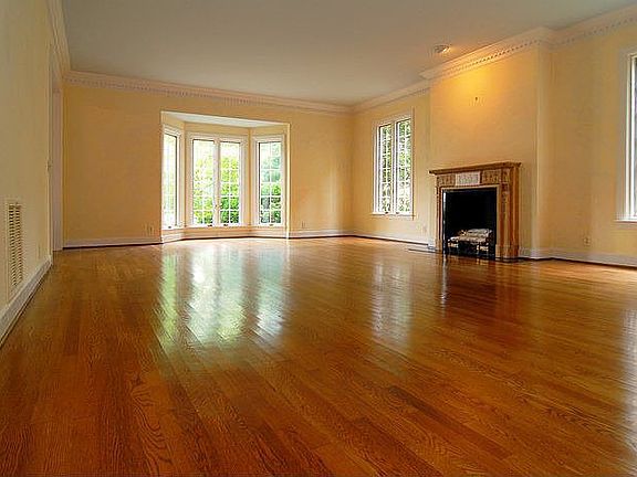 Large living room w/fireplace and Tall Windows