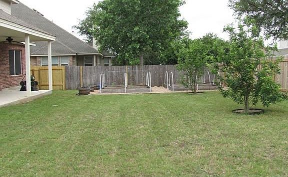 This huge yard provides plenty of space for kids and pets to play.