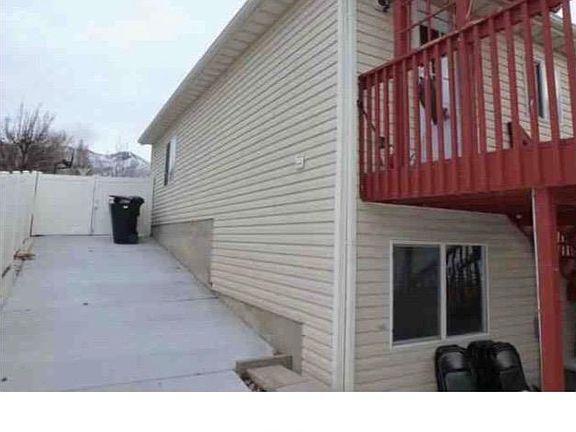 Concrete pad on side of house