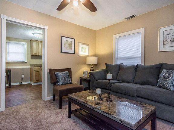 Couch, end table, lamp, coffee table included.