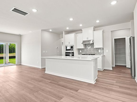 Great room in the Roswell floorplan at a Meritage Homes community in Clayton, NC.