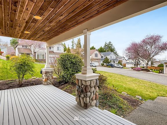This beautiful covered front porch overlooks the quiet, established neighborhood of Pinehurst.