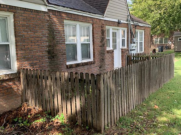Side entrance of kitchen leading to designated offstreet parking