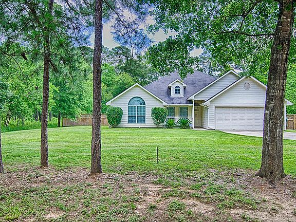 The lot is partially wooded and is just under a 1/2 acre in size. Plenty of elbow room here! Concret